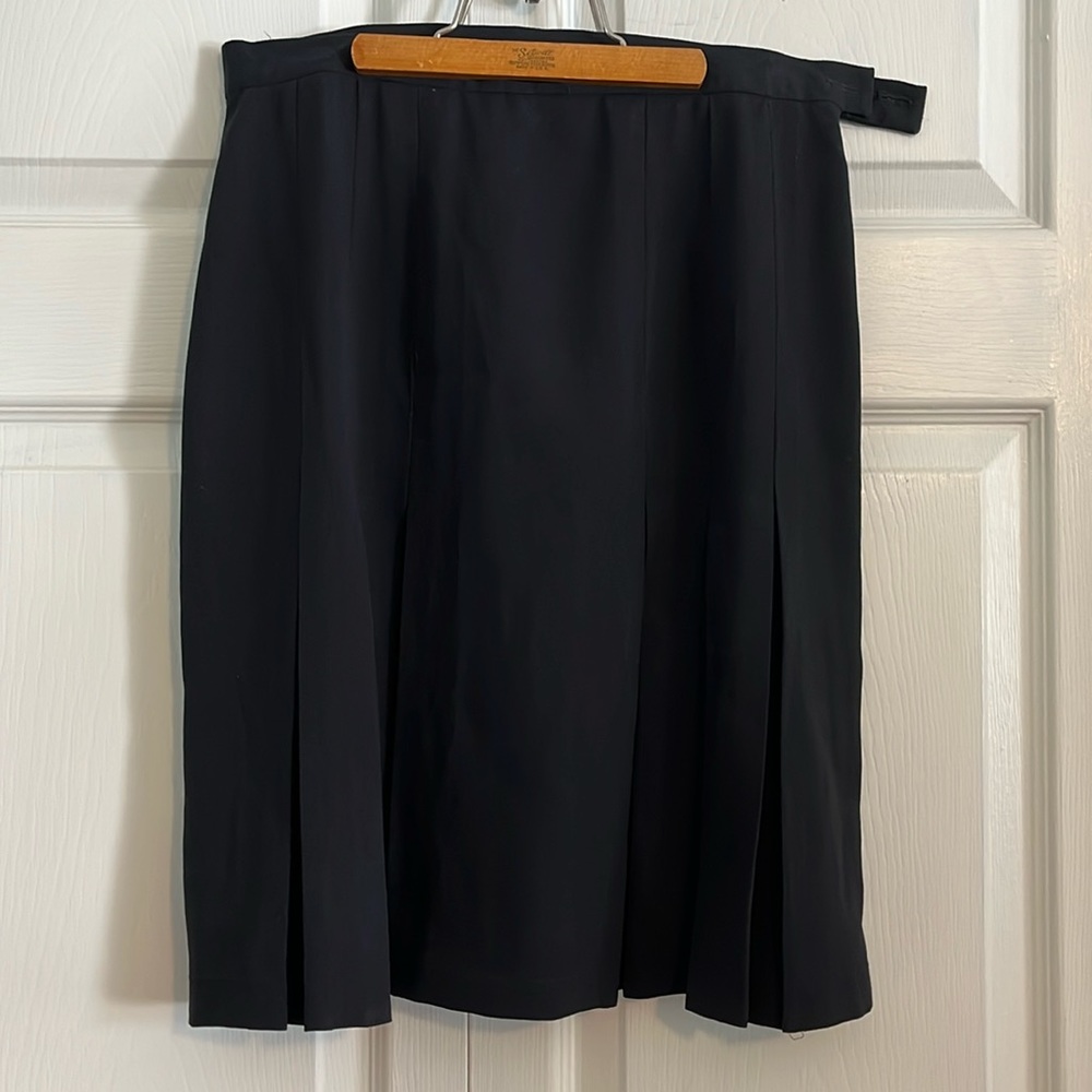 Ladies black pleated skirt.